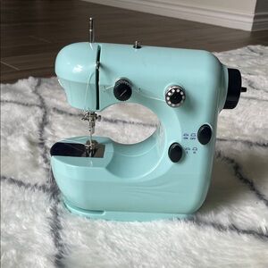 Compact Mint Green Sewing Machine